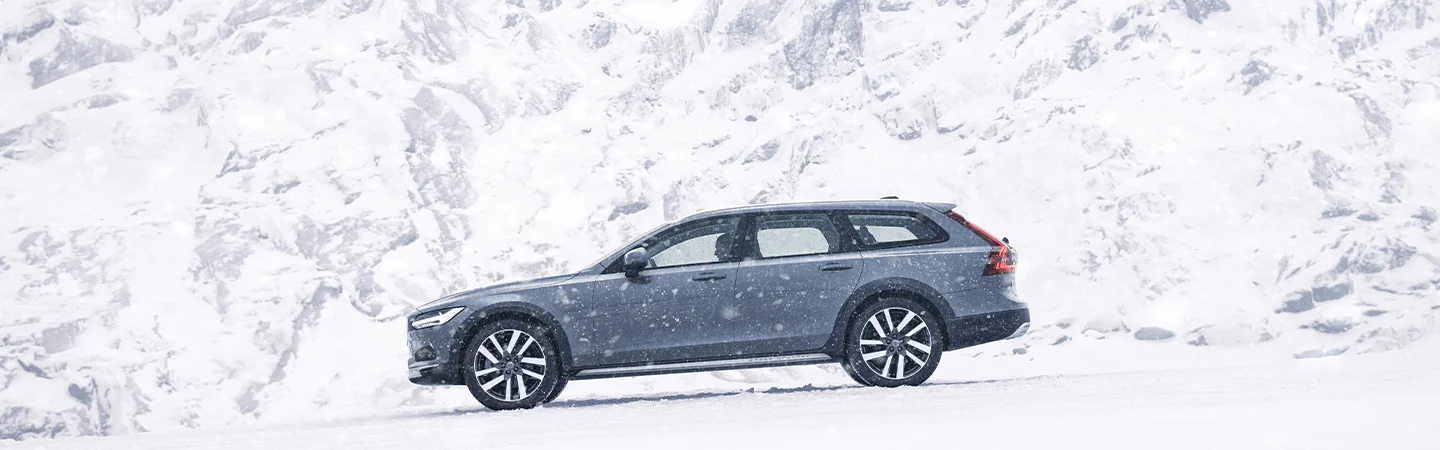 a parked 2025 Volvo V90 Cross Country Plus in snowstorm
