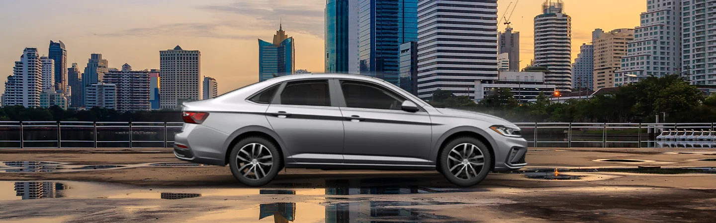 side view of a silver 2025 Volkswagen Jetta SEL parked in city