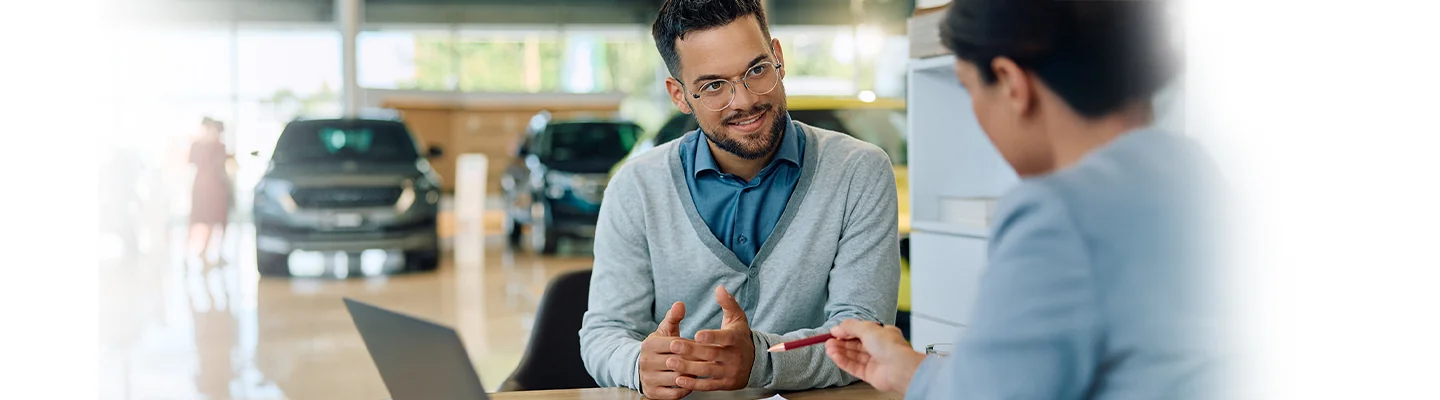 Sales person talking to custmer about lease and lease maintenance