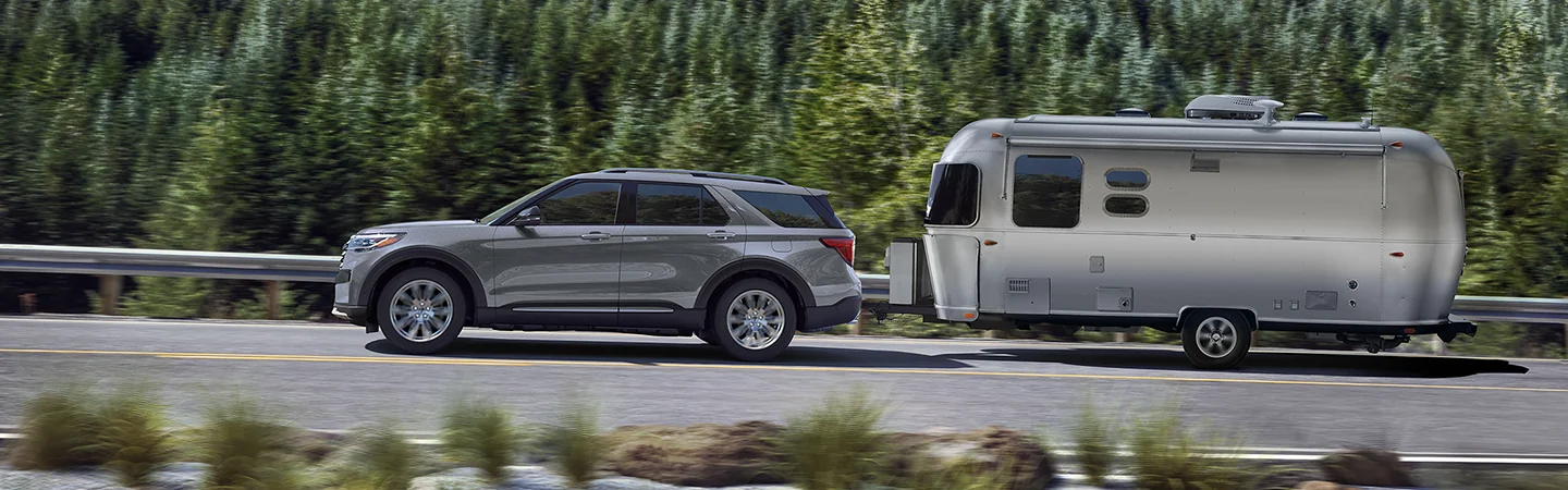 a 2026 Ford Explorer Active 100A towing a camper