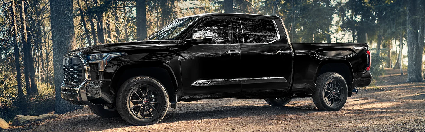 a driver side view of a black 2026 Toyota Tundra