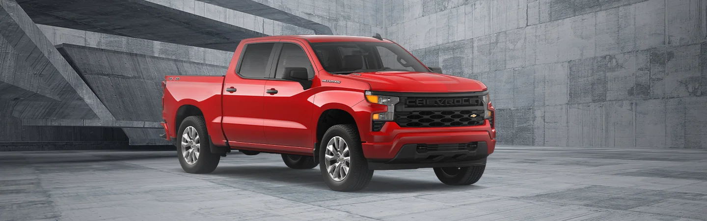 A red 2025 Chevrolet Silverado 1500 parked in a gray room