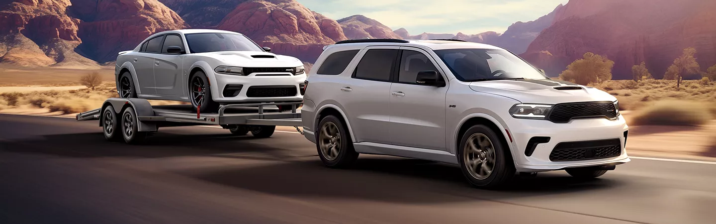 2026 Dodge Durango towing another car on a trailer