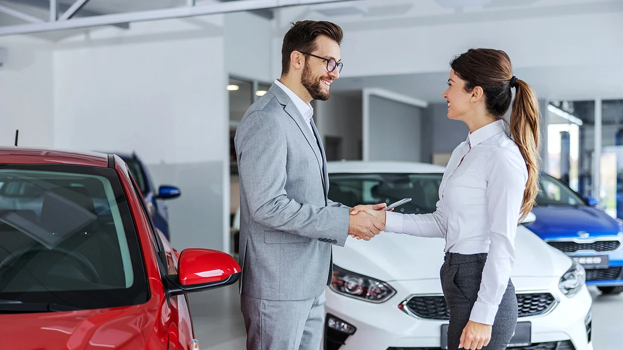 Sales person shaking hand of customer