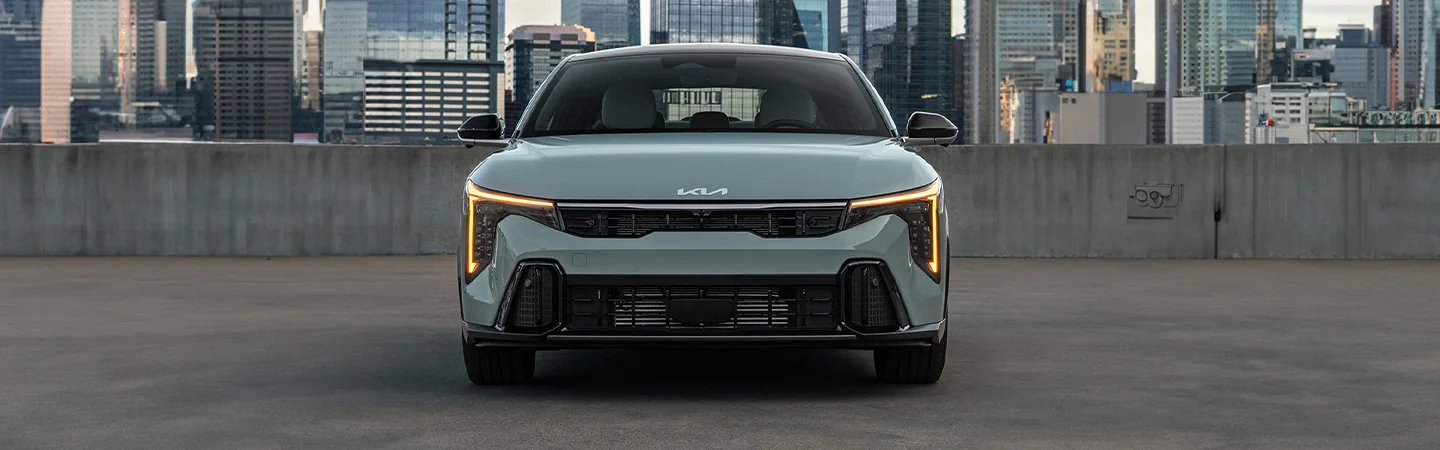 2025 Kia K4 Sliver color car Stand on road Front view