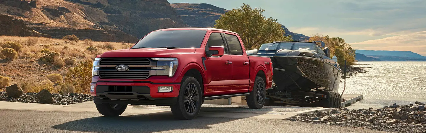 2024 Ford F-150 vs RAM 1500 front view white