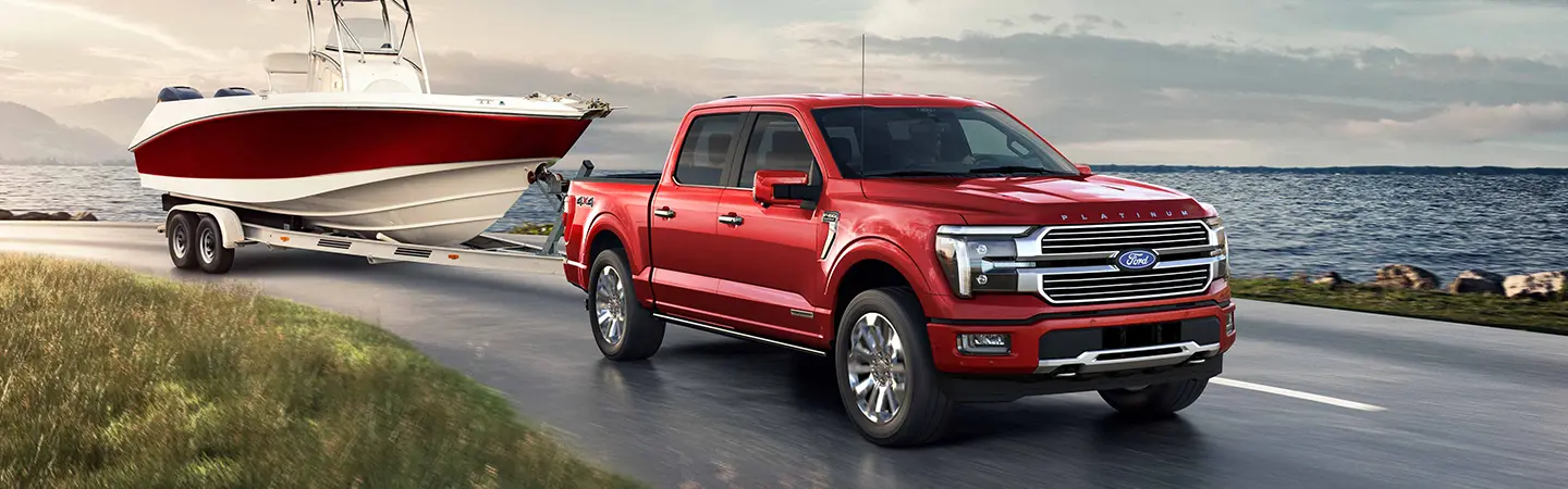 2024 Ford F-150 vs RAM 1500 front side view red