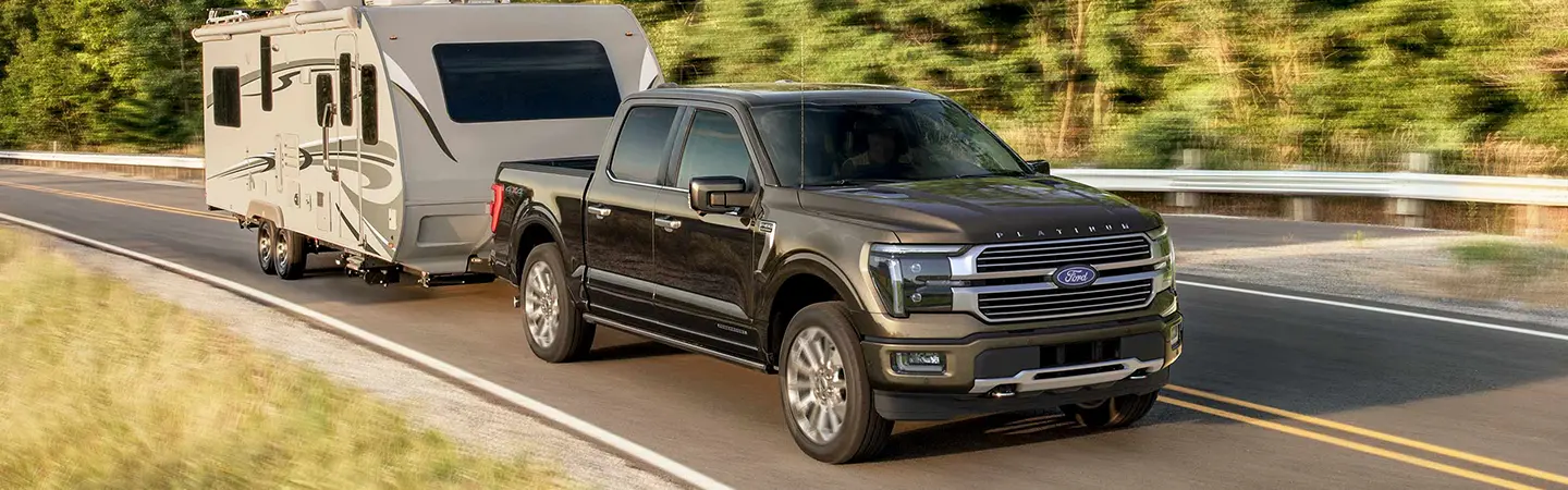 2024 Ford F-150 vs RAM 1500 front side view red