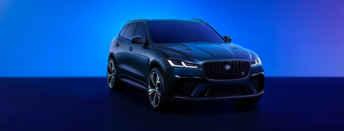 2026 Jaguar F-PACE parked in front of a night sky