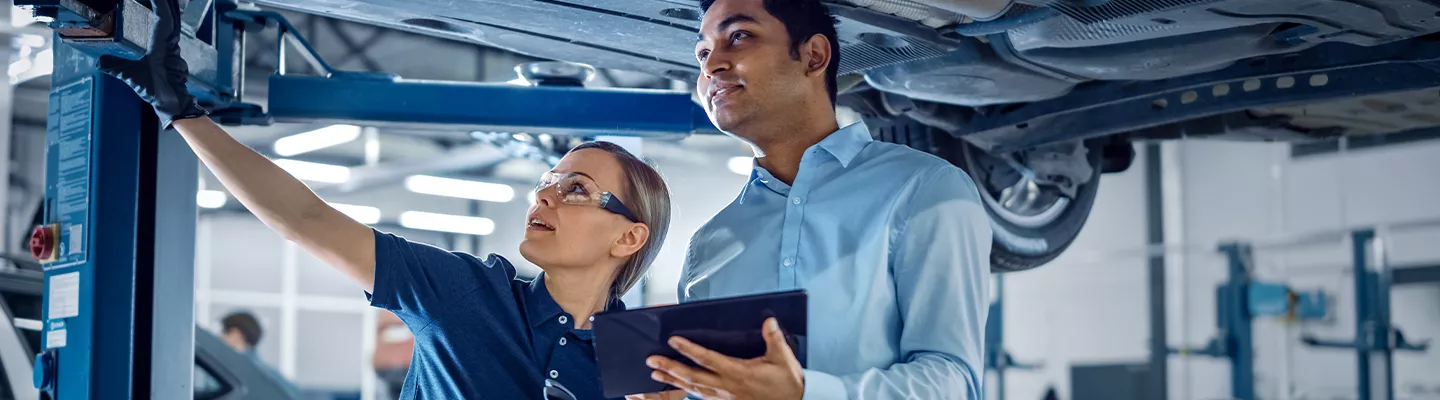 Service technicians looking at a vehicle