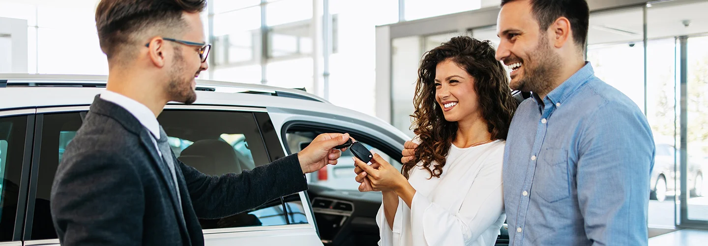 people buying car in showroom