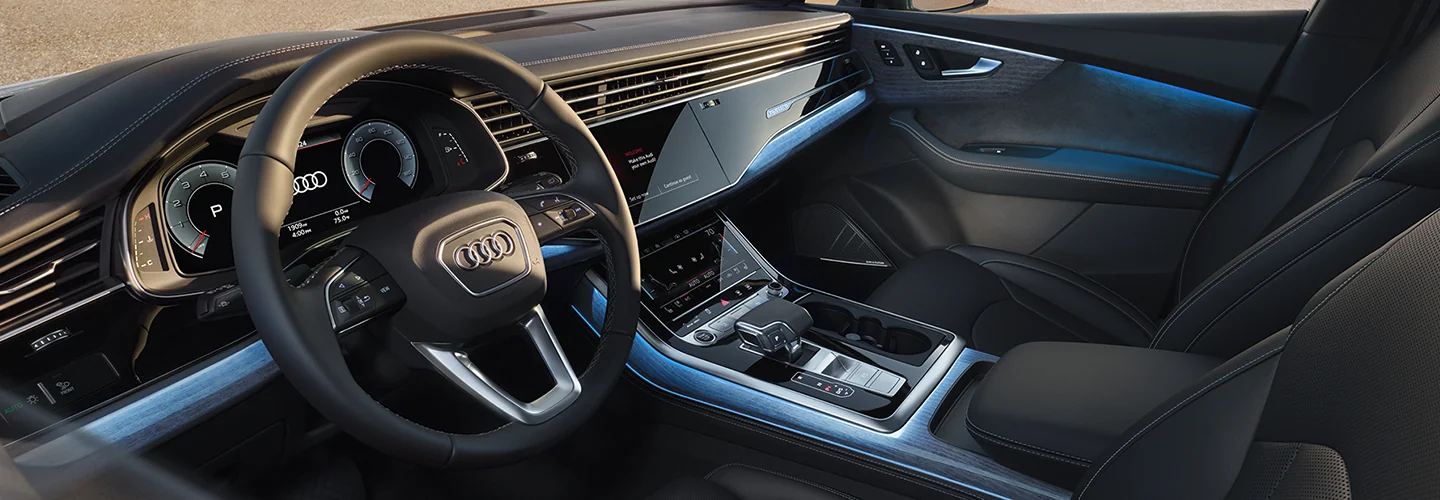Interior view of the front seat and dashboard of a 2025 Audi Q7