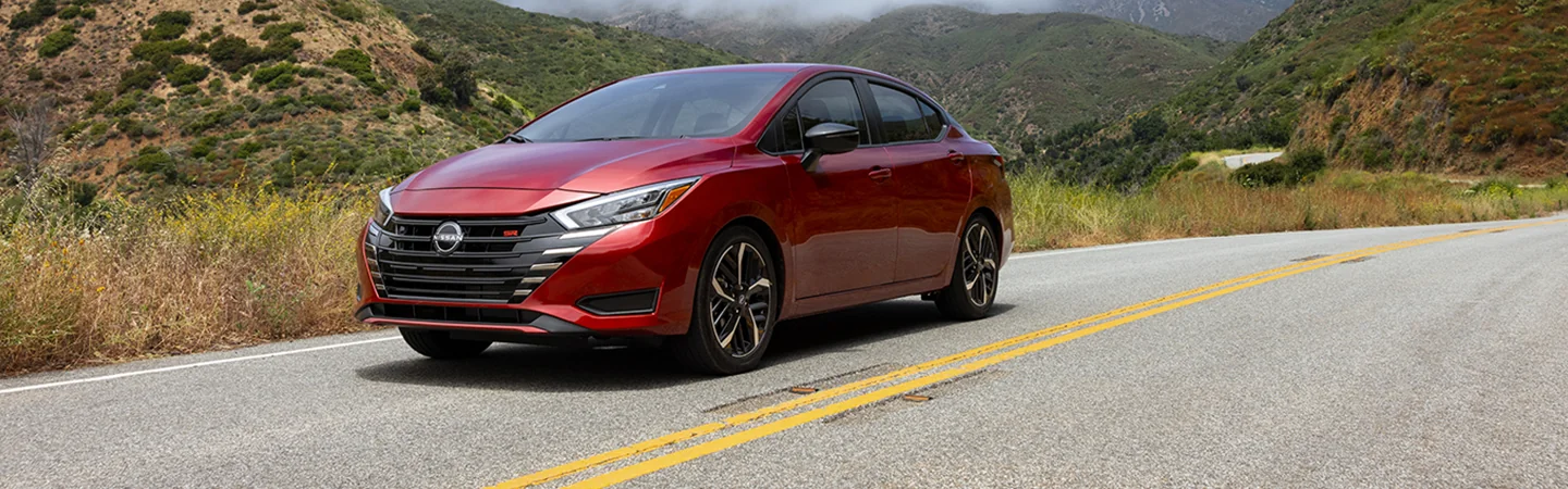 red 2025 Nissan Versa S in motion