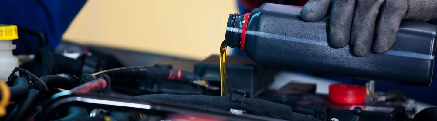 car motor oil being poured in