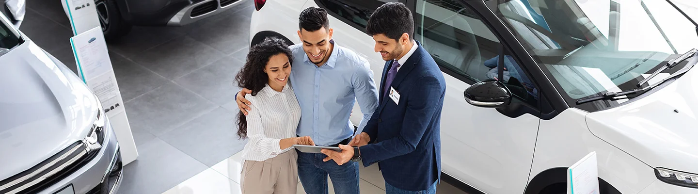 people shopping in car showroom in Nederland TX
