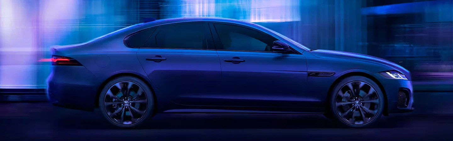 2024 Jaguar XF vs Mercedes-Benz E-Class front side view blue