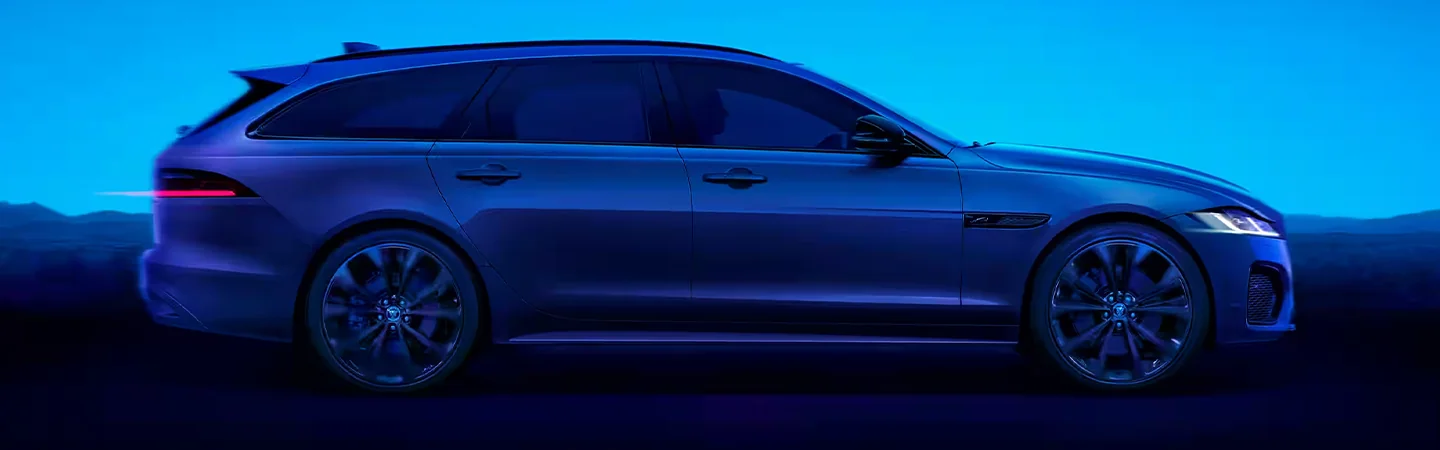 2024 Jaguar XF vs Mercedes-Benz E-Class side view  blue