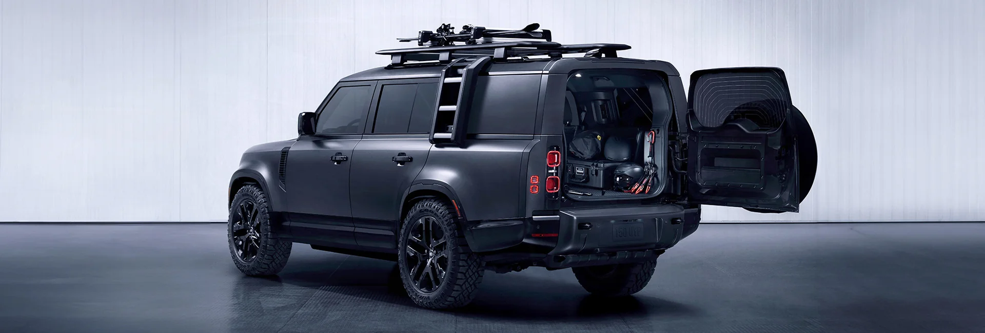 Gray Defender with its back door open