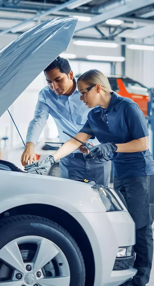 Technician servicing a vehicle