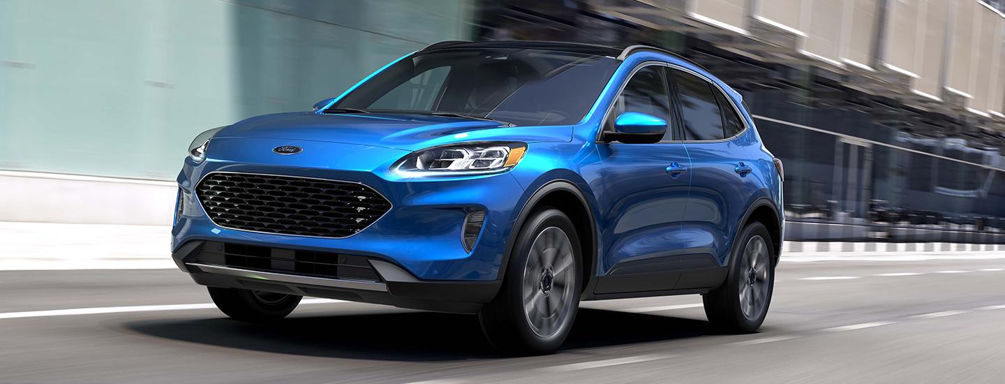 A metallic blue 2021 Ford Escape in motion