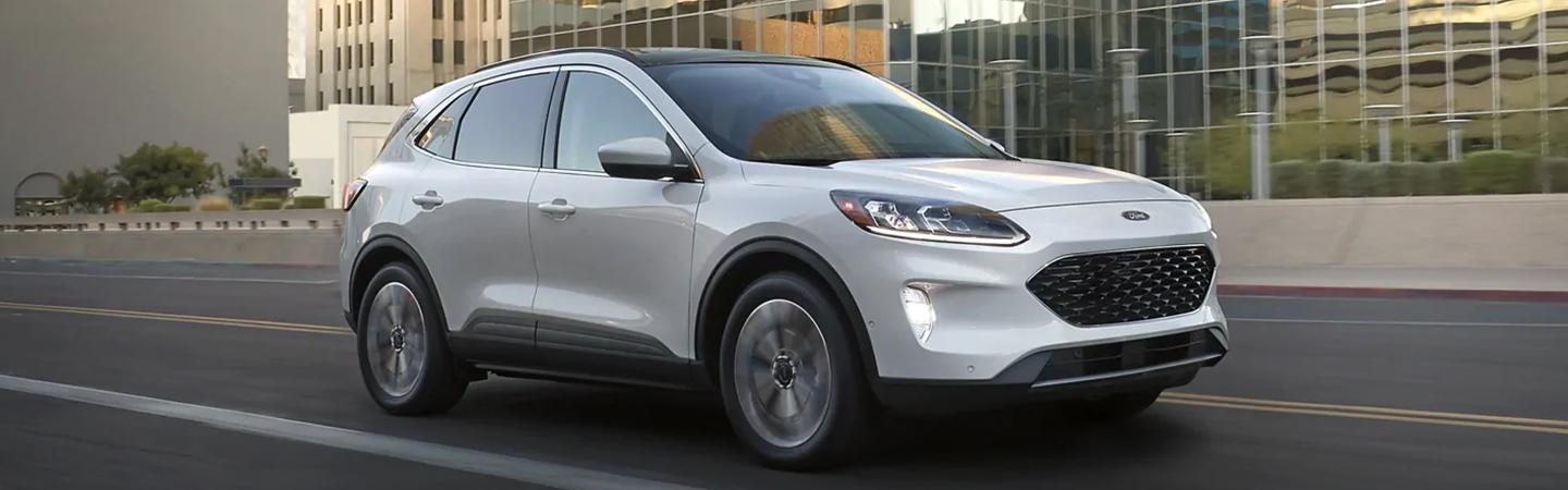 A white 2021 Ford Escape in motion
