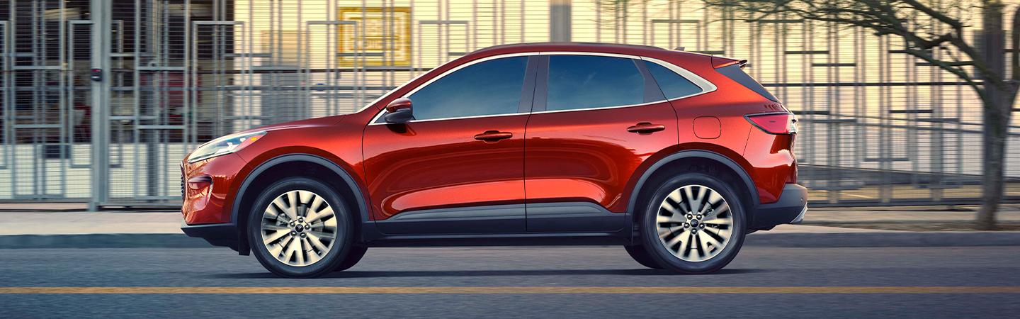 A 2021 Ford Escape driving downtown
