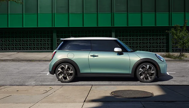passenger side view of a light colored MINI model