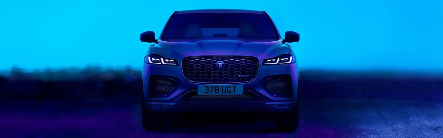 2024 Jaguar F-Pace vs 2024 BMW X5 front side in blue