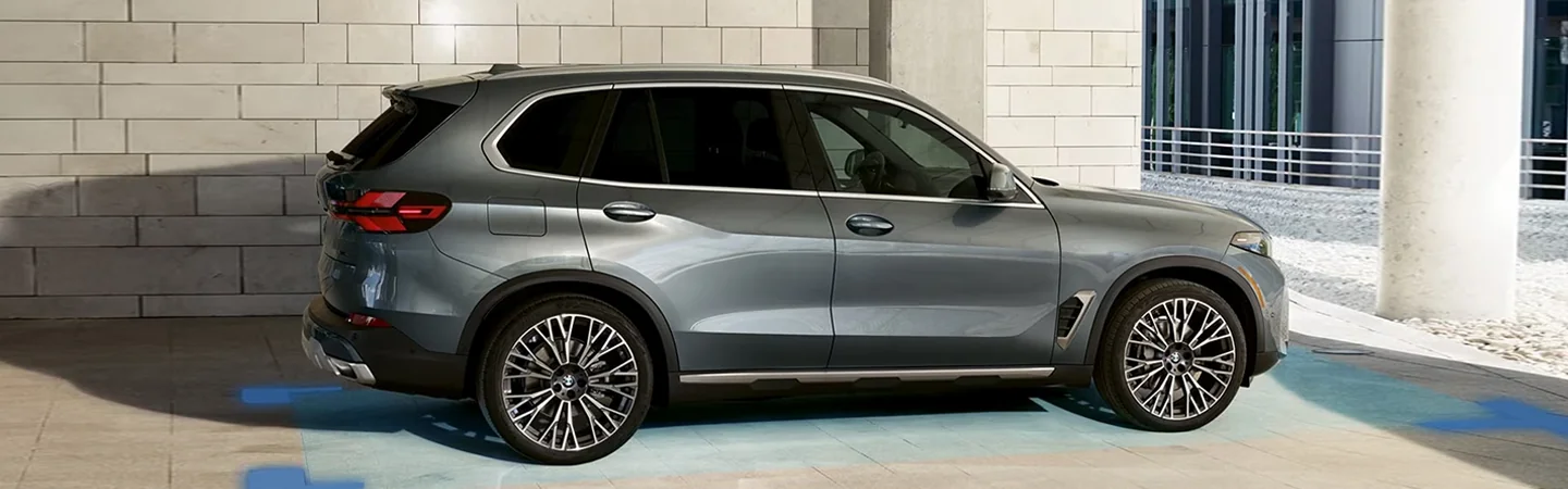 2024 Jaguar F-Pace vs 2024 BMW X5 side front in silver