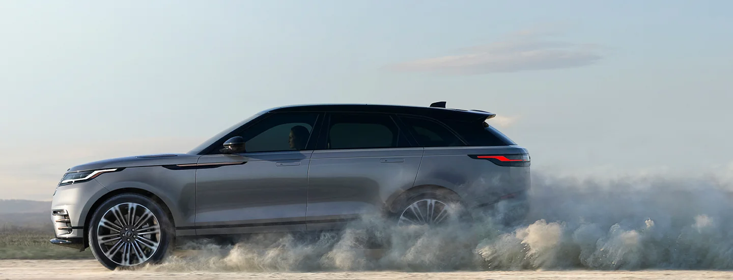 2026 Range Rover Velar driving on a dirt road