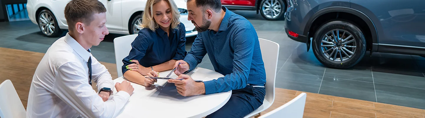 Sales person talking to customers about leases