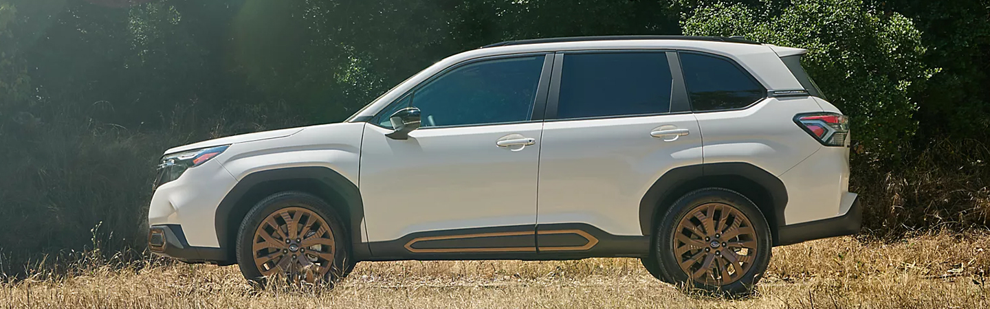 2024 Subaru Forester vs Nissan Rogue whitecolor sideview