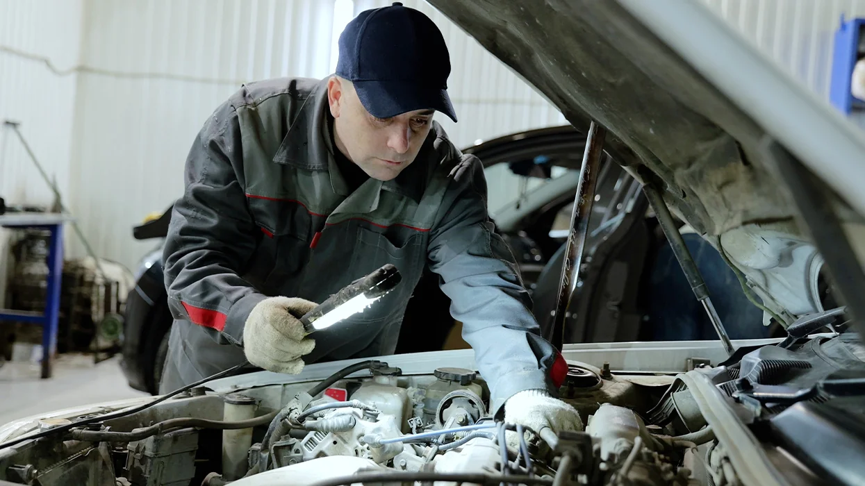 Service tech checking out engine