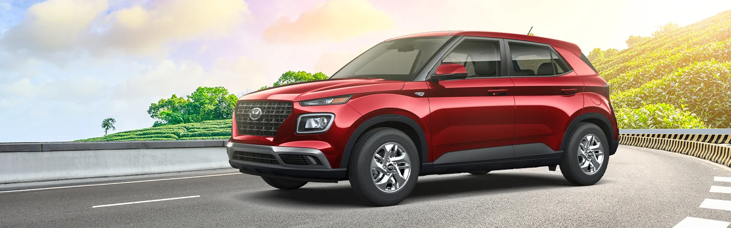 red 2025 Hyundai Venue parked on highway