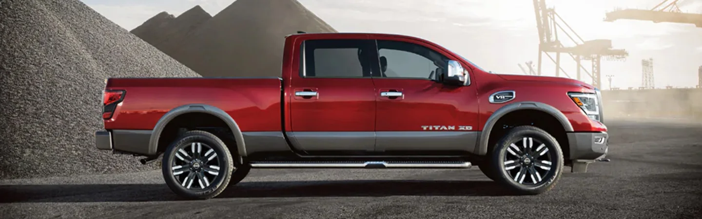 2024 Nissan Titan Specs side front in red