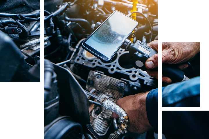 auto mechanic working on car testing inside engine at Douglass Subaru in Waco, TX