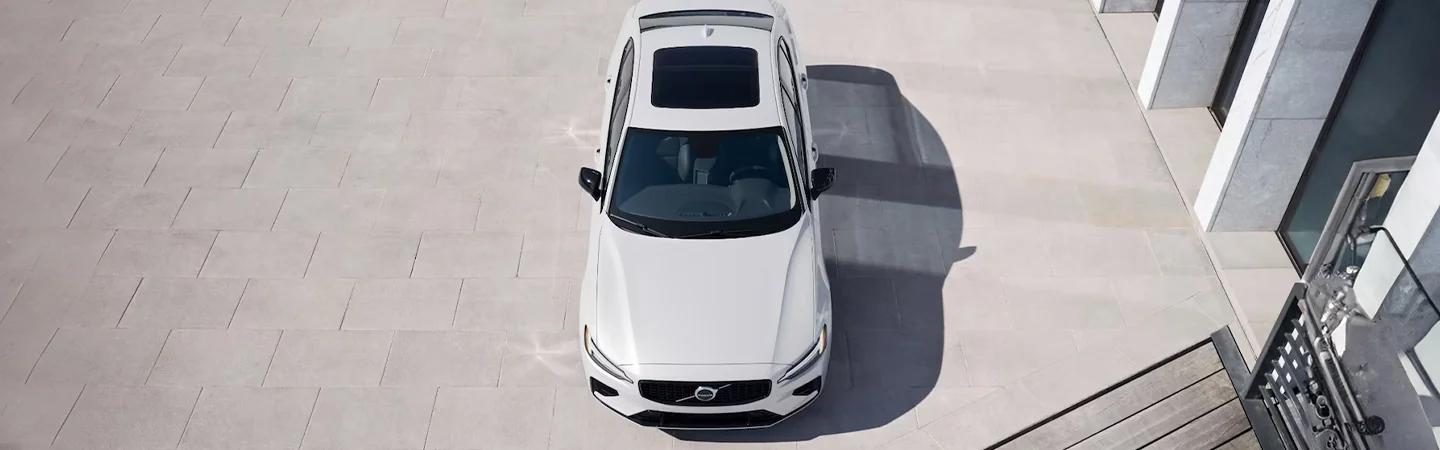 Top view of a parked white 2024 Volvo S60 Recharge