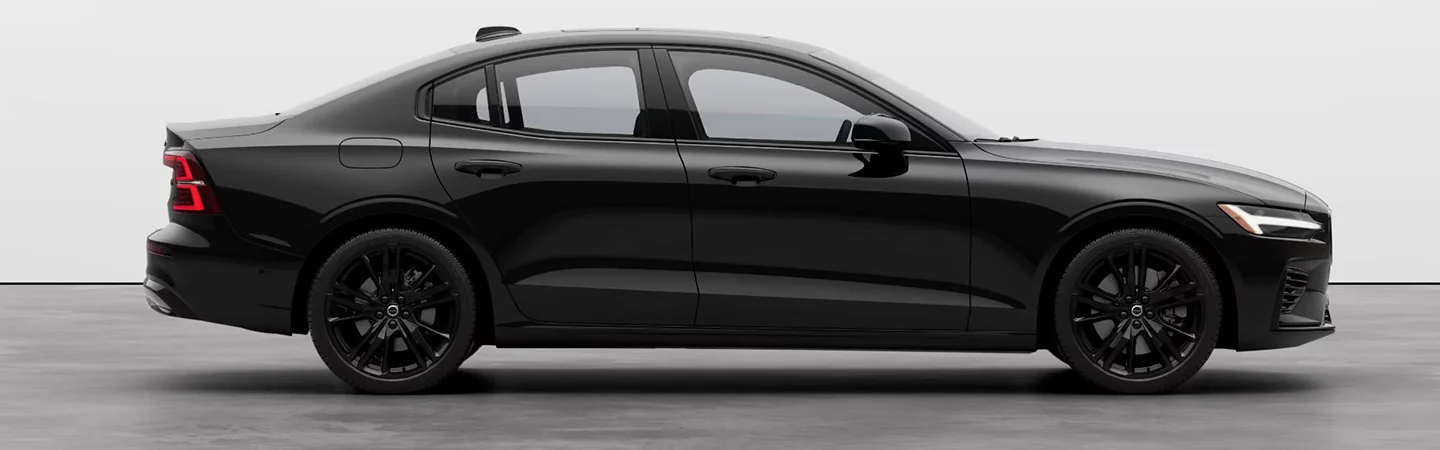 side view of a parked blacked 2024 Volvo S60 Recharge
