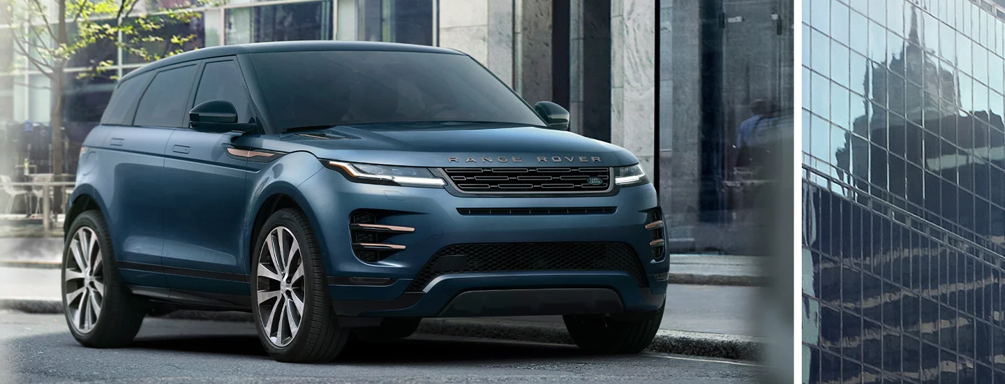 Front view of a blue 2026 Range Rover Evoque parked in front of a building