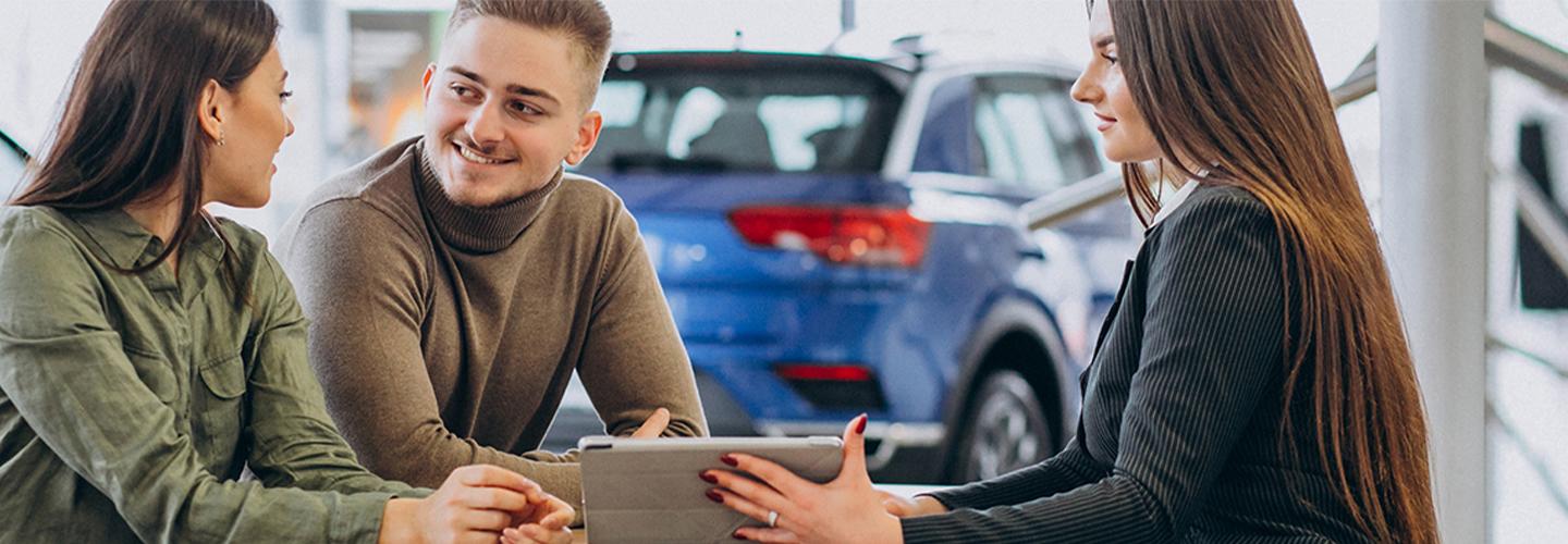 2 people talking with a salesperson