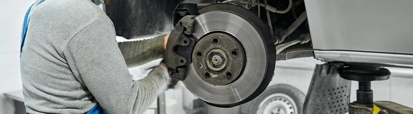mechanic working on brakes 