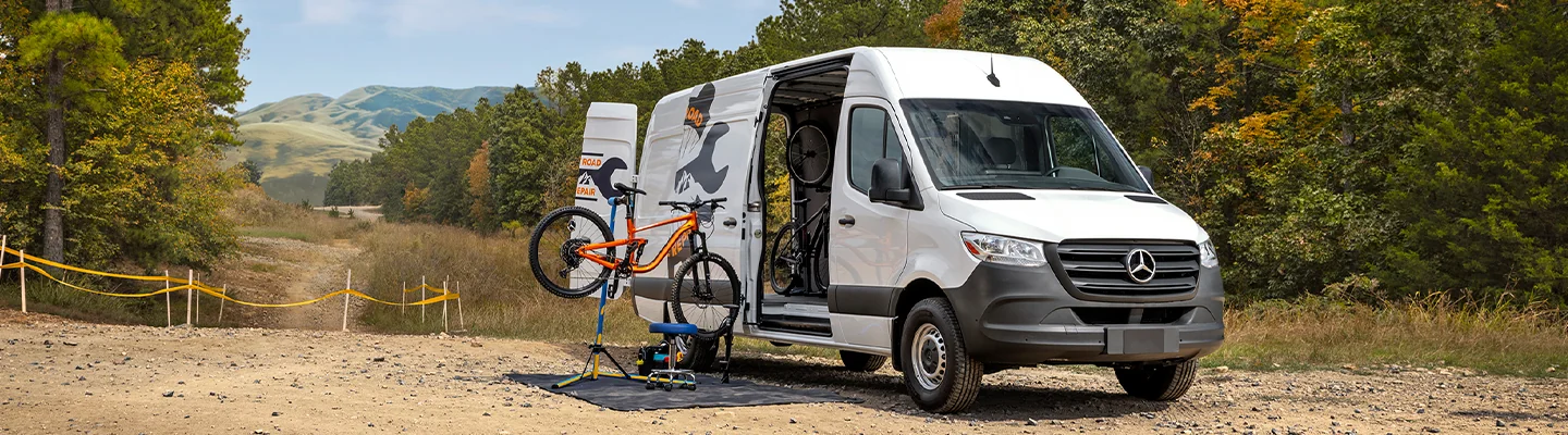 2025 Mercedes-Benz Sprinter Cargo Van parked and fixing a bike