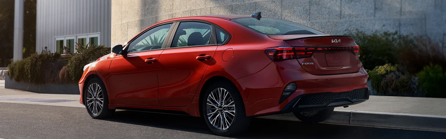 2024 Kia Forte side back in red 