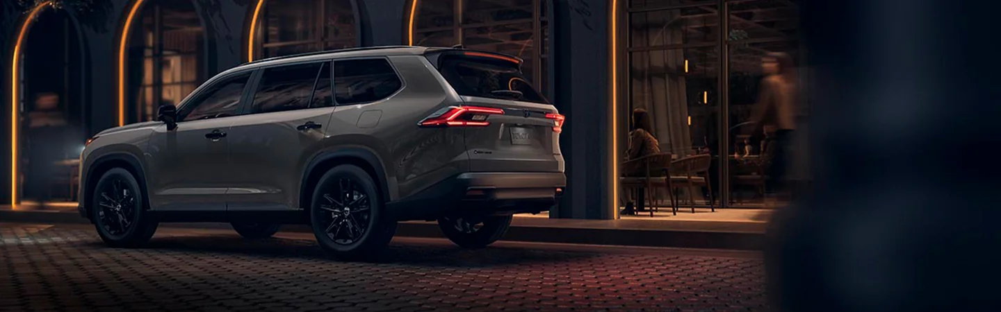 Gray 2025 Toyota Grand Highlander outside a restaurant