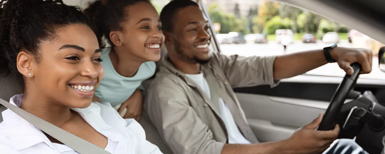 Family driving in their new Toyota