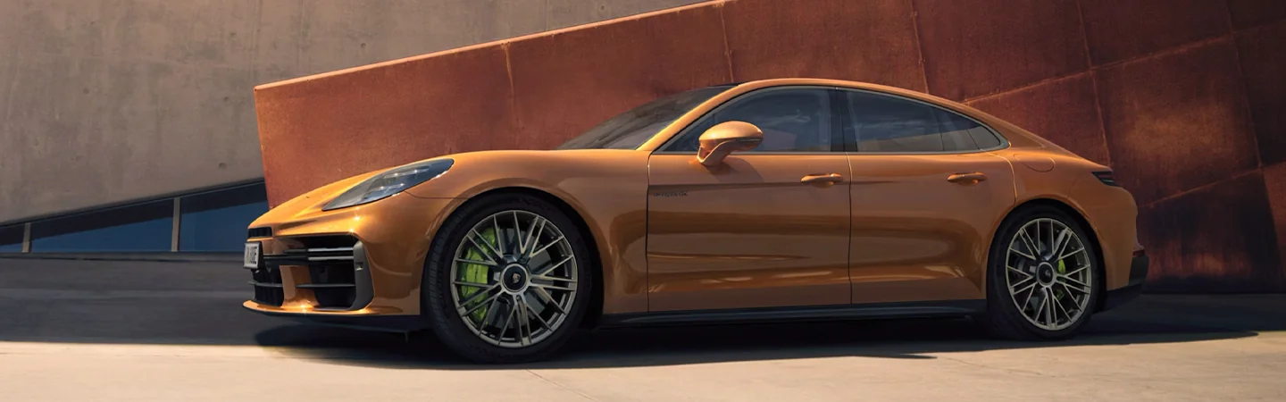 2024 Porsche Panamera Specs side front in orange