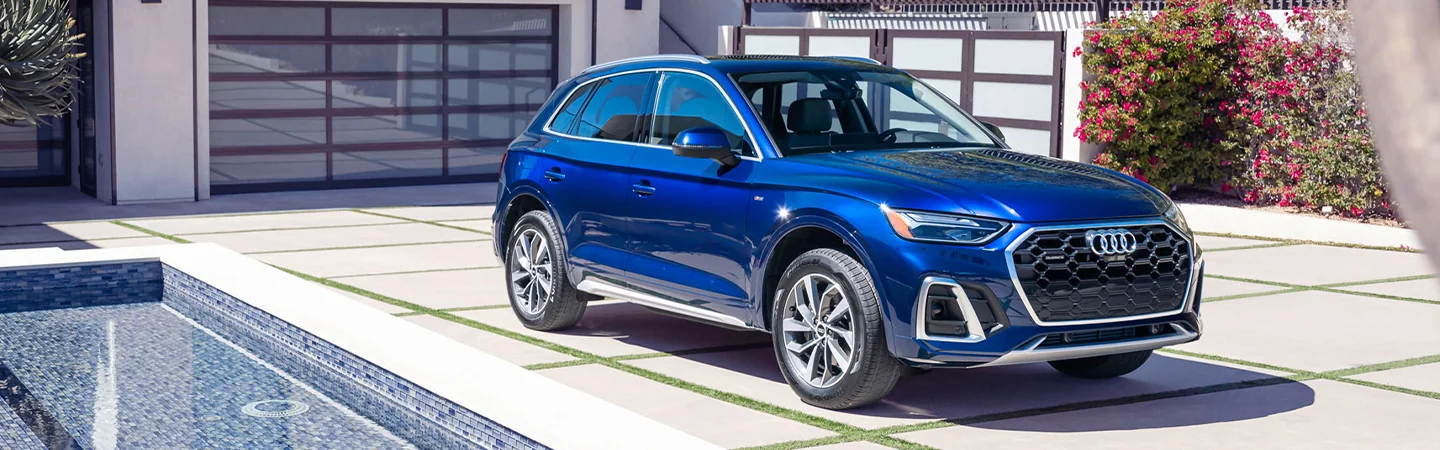 blue 2024 Range Rover Evoque parked in driveway