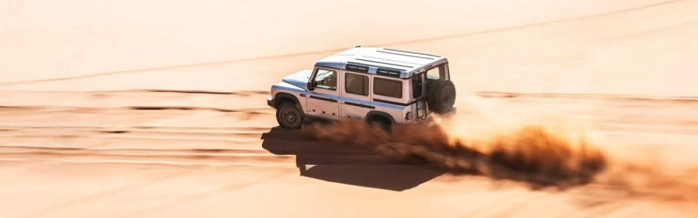 2024 INEOS Grenadier vs Jeep Wrangler white side view