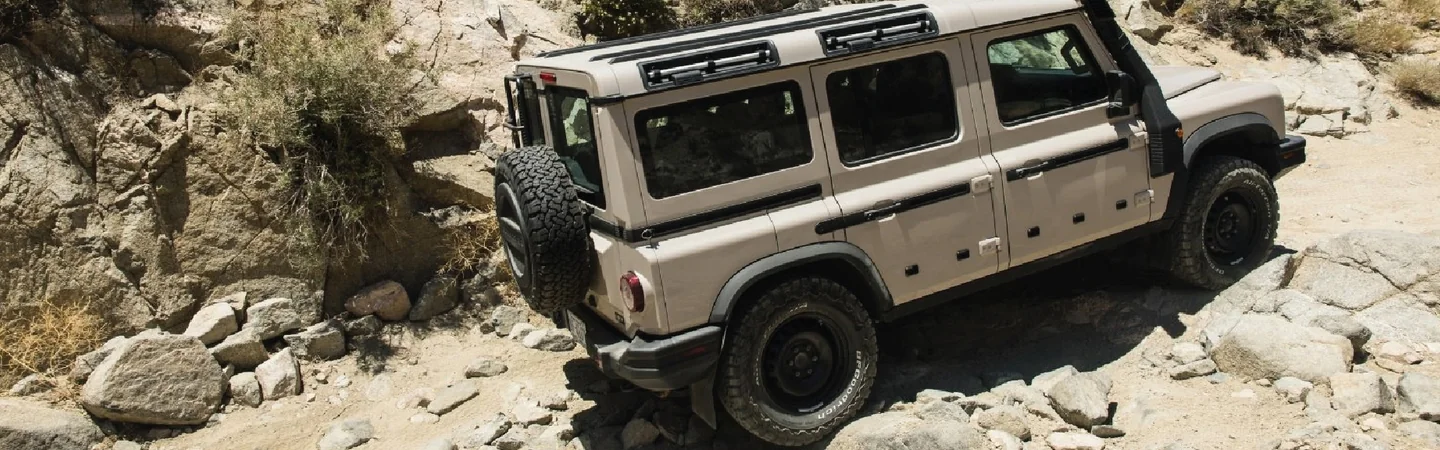 2024 INEOS Grenadier vs Jeep Wrangler white side view