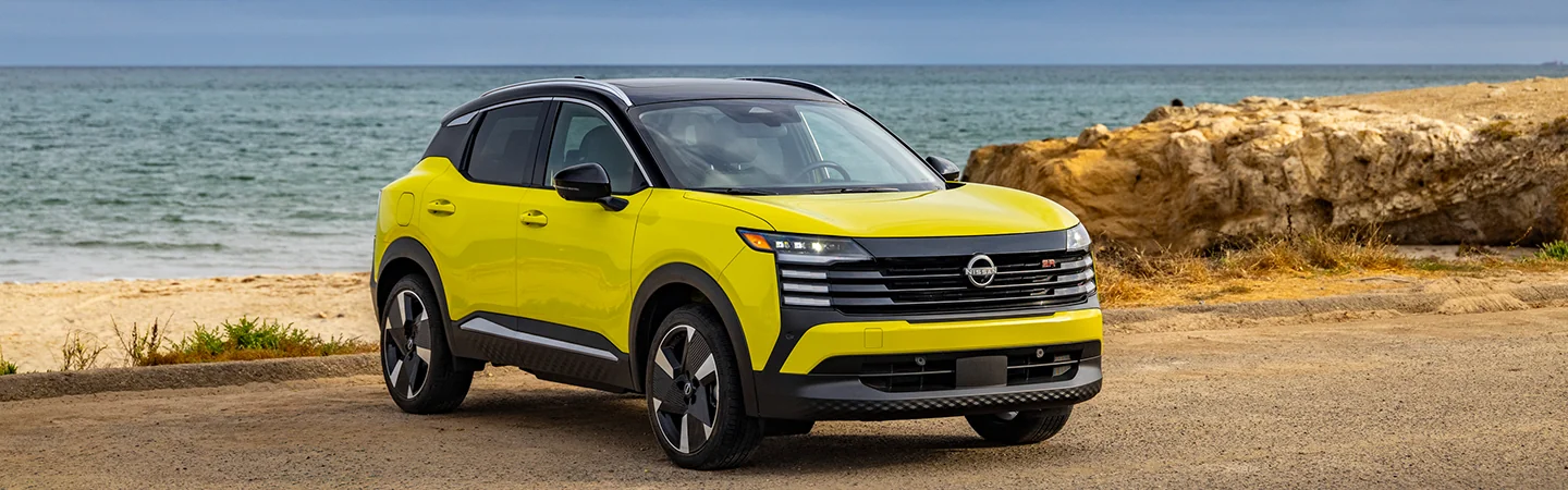front view of a bright yellow 2025 Nissan Kicks S